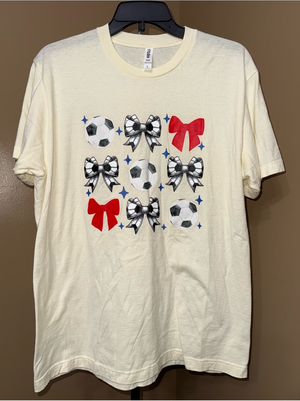 🌼SOCCER Ivory Soccer & Bow Graphic Tee. Size Large.🌼